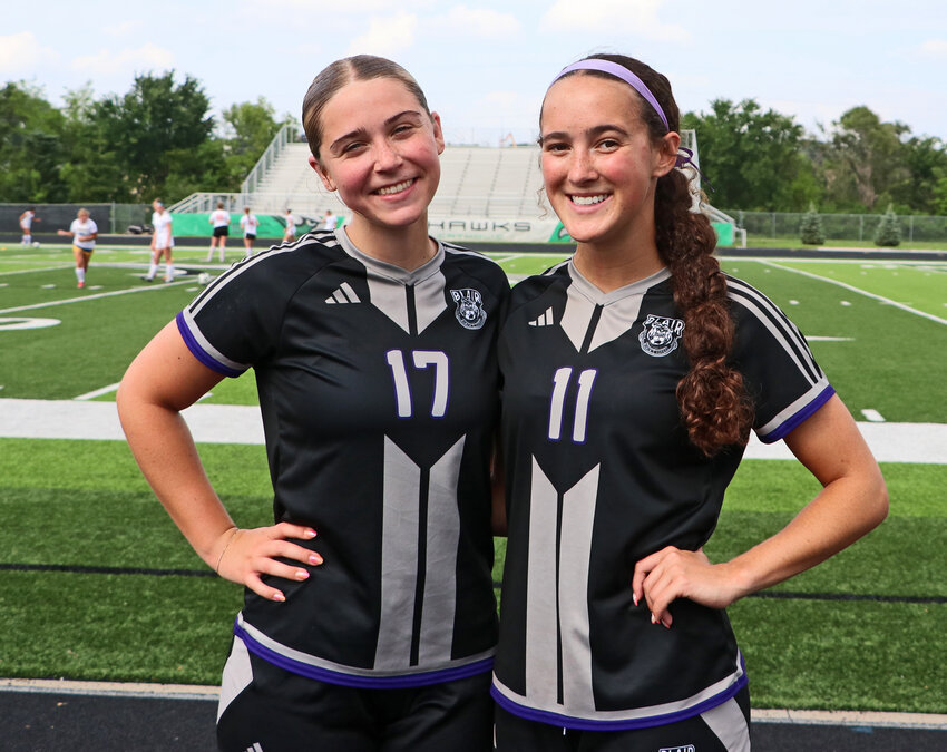 Recently-graduated Blair Bears Blythe Knight, left, and Brynn Ray pose for a photo before the start of the Special Olympics Nebraska Senior Soccer Showcase on Friday at Omaha Skutt.