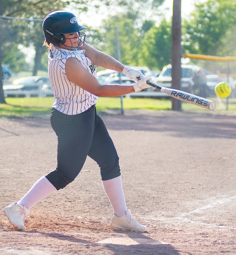 Myesha Larson gets a solid hit against Pender as the 18s cruise to victory.