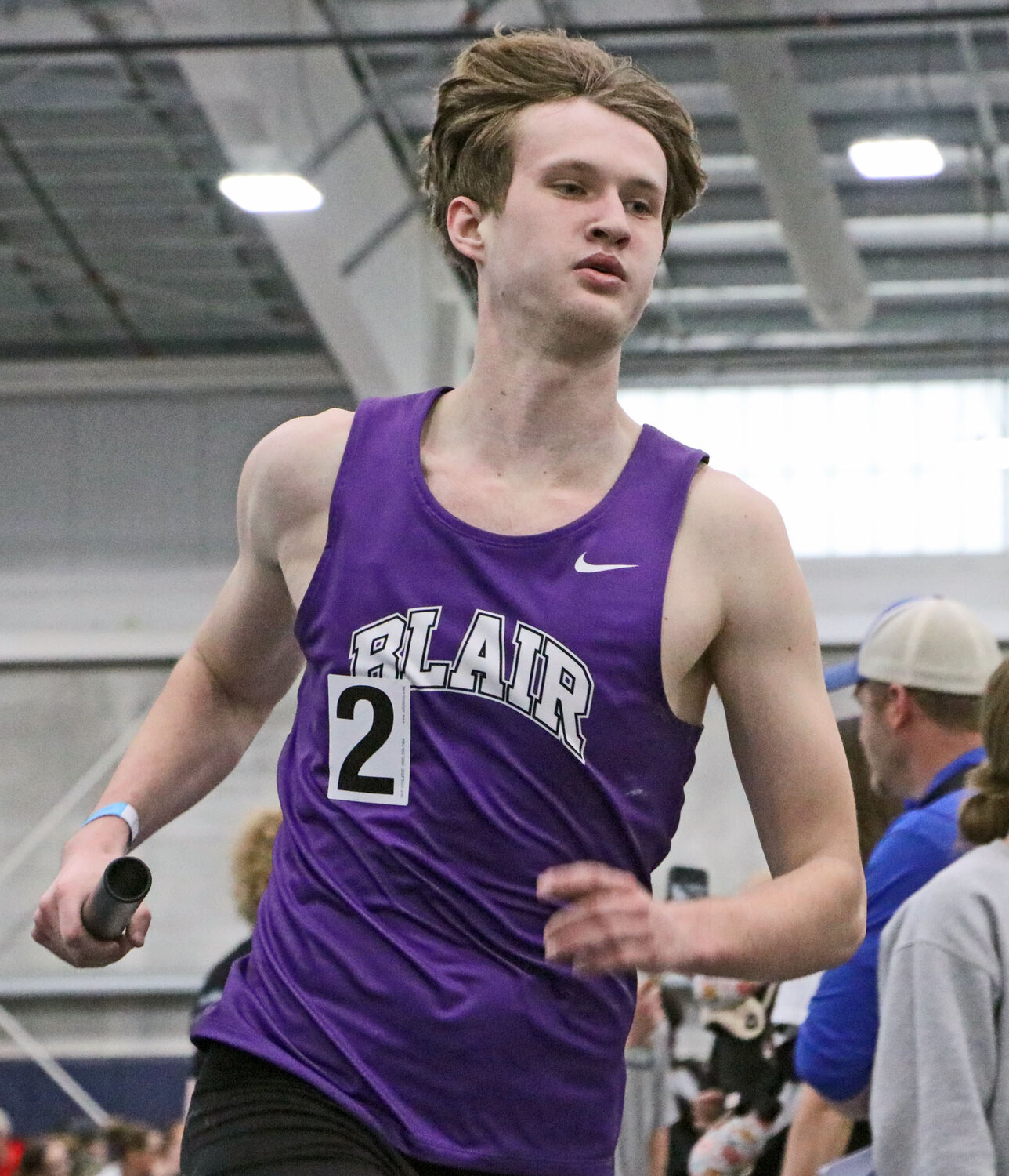 Blair's Caleb Funk runs a relay race Thursday at Concordia University.
