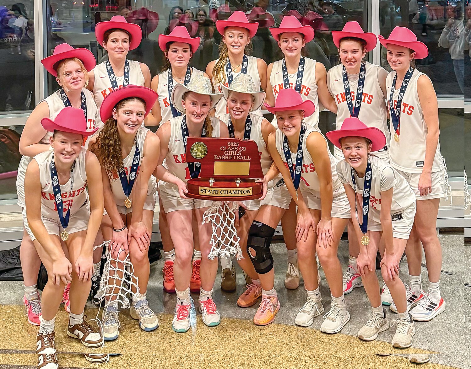 Lady Knights get it done in Lincoln securing a Class C2 State Basketball Championship over the weekend.  Congratulations to coaches Scot Guzinski, Chris Johnson, and Eric Mlinar and team members (front from left) Carolyn Magnusson, Briar Ray, Bailey Pelan, Adi Rennerfeldt, Emma Anderson, and Sabrina Rost; back from left, Naomi Gahan, Brinley Burton, Brylee Ahrens, Marysa Moseman, Hilary Ray, Sonya Guzinski, and Mia Thomsen!  Read more on the amazing feat inside.