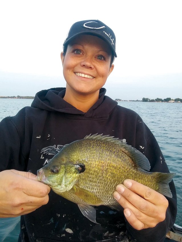Not a lot of South Dakota lakes have big bluegills, but when they do, it isn&rsquo;t uncommon to catch gills and perch together. Emily Bruns nabbed this big &rsquo;gill while jigging for perch.