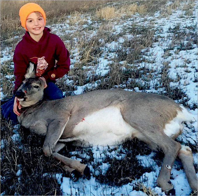 Sutton Bjorkman of De Smet shot his first deer with his dad, Nick. Sutton was very proud to use his grandpa John's rifle. Great shot!