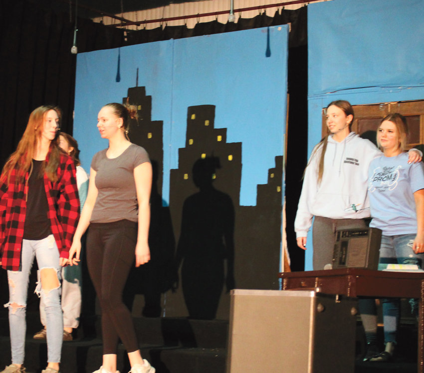 &ldquo;Annie Jr.&rdquo; was performed this last week by the Iroquois High School. This was Mr. Darold Rounds&rsquo;s last production, as he will be retiring from teaching at the end of this school year. Pictured are Katie Dubro (hidden in back), Kaitlyn Konshak, Samantha Torguson, Rosalie Wehlander and Hannah Hofhenke practicing for the show.