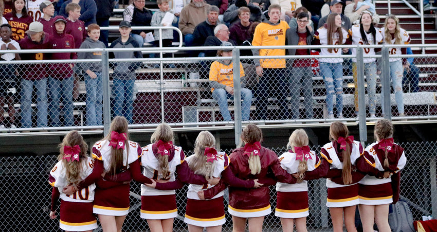 De Smet&rsquo;s cheerleaders stir up excitement in the audience at the Homecoming game at Wilkinson Field. The Bulldogs shut out the WiLdKats 44-0.