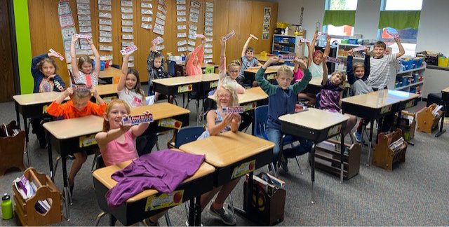 Students in Iroquois celebrated three patriotic holidays that fall on the same day, Sept. 17. Third grade students each received a Proud to be an American bookmark. These bookmarks have The Pledge of Allegiance written on the back side. The elementary student council now uses the district loudspeaker to recite the Pledge every morning.