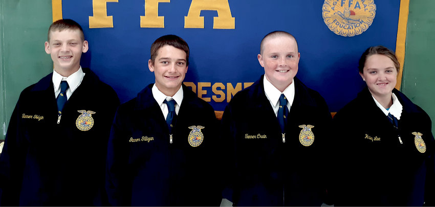 Tanner Tolzin, left, Gannon Gilligan, Tanner Crain and Hailey Lee are the four freshman FFA members who received new FFA jackets and ties or scarves that were sponsored by members of the class of &lsquo;61 as a memorial for Richard Baier.  Baier was active in FFA through high school.  A patch which will be sewn on the inside pocket of each jacket says, &ldquo;Sponsored by members of the class of &lsquo;61 in memory of Richard Baier.&rdquo;