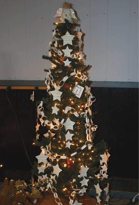 Most Creative, First Place went to De Smet Community Church with a theme, Hark the Herald Angels Sing. The tree was topped with an ornate angel, and adorned with paper chains homemade star ornaments.