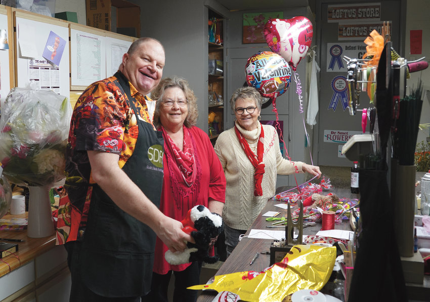 Chad Kruse, left, Barb Hansen and Lynn Kruse were busy Monday, Valentine&rsquo;s Day, at De Smet Flowers and Gifts, assembling floral arrangements, balloon bouquets and assorted baskets, while delivery drivers were also occupied, taking the items to their customer&rsquo;s intended love interest. Men account for 73 percent of floral sales on Valentine&rsquo;s Day. Valentine&rsquo;s Day originated during Roman times. Roman goddess Venus is known for love and beauty, with the red rose supposedly her favorite flower.