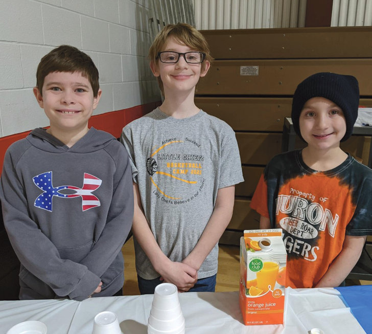 Iroquois Elementary Student Council members Zachary Almont, left, Connor Dant and Nataley Wendel helped during last Wednesday&rsquo;s Read 'n Roll event by serving rolls, juice and coffee to families in attendance.&nbsp;