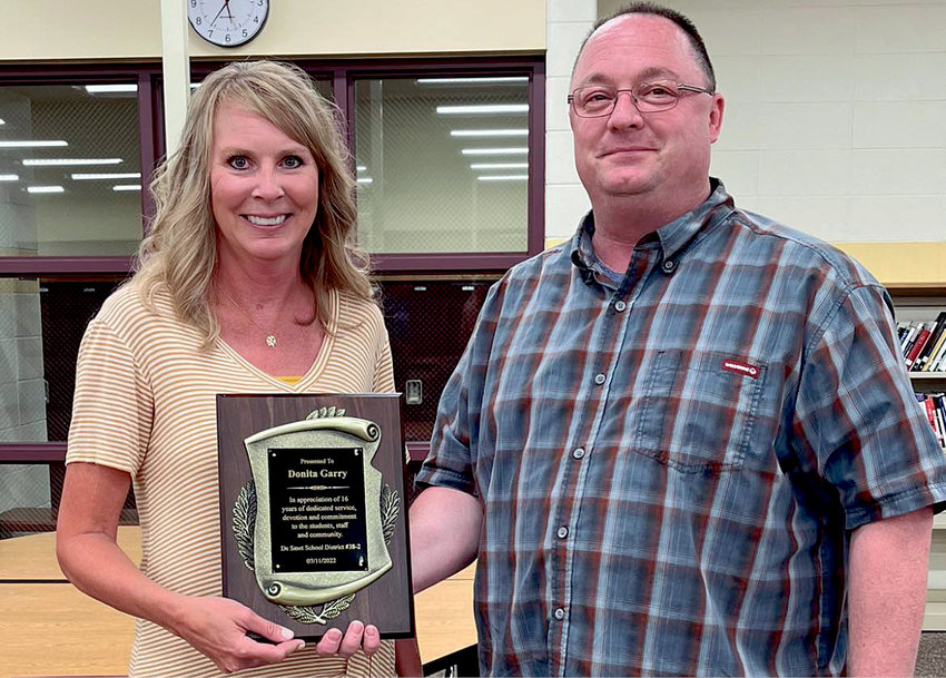 Donita Garry was presented with a plaque from Shane Roth to thank and recognize her for 16 years of service on the De Smet School Board at the Mon., July 11, 2022 meeting.