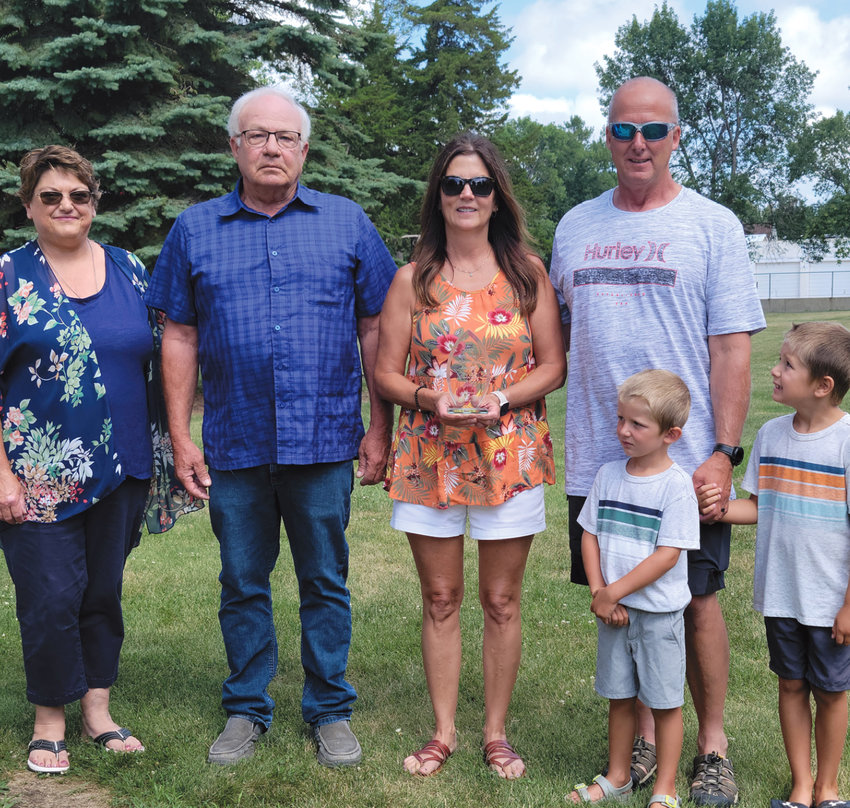 Roselyn Sjolie's family was honored Sunday for all of her work throughout the years on the Chamber and for the town. Lisa Casper, left, Chamber president,  Doug Malone, Jan Lemme, Mark Sjolie and his sons, Granger and Braven.