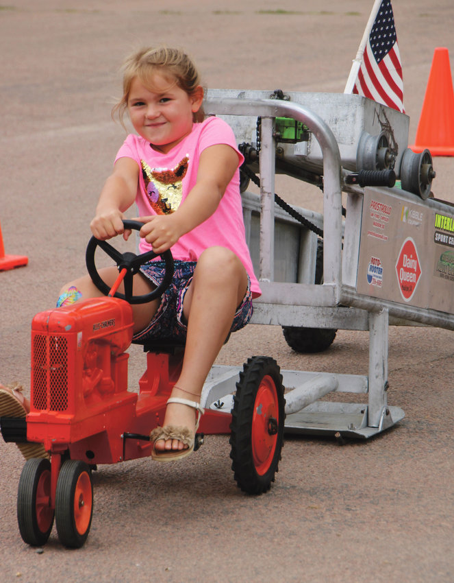 A little girl enjoys the pedal pull event at Cabaret Days in Carthage this past weekend.