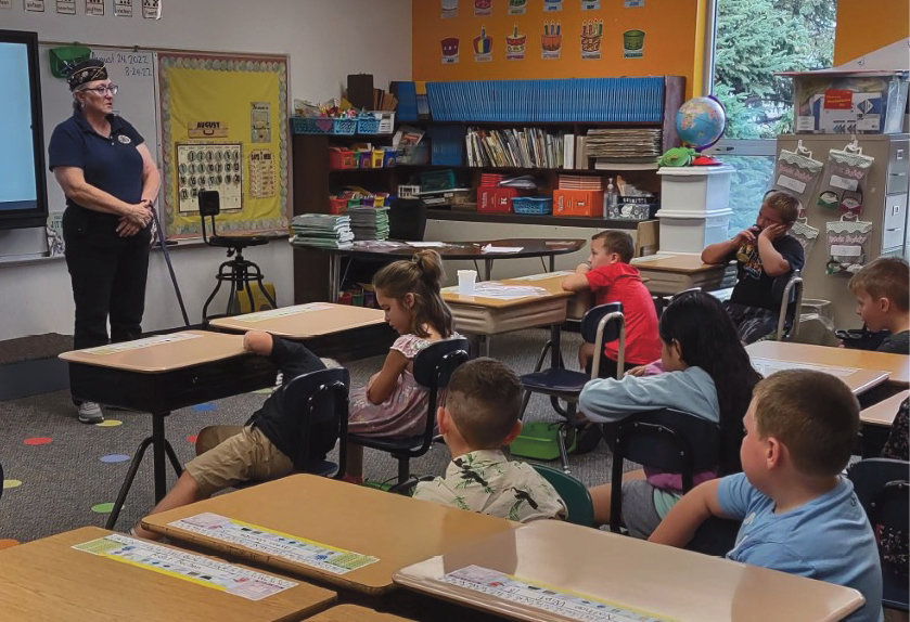 Annette Dunham, Americanism Officer with the Bensley-Rounds American Legion Post 280 of Iroquois, provided flag etiquette education to the fifth&nbsp;graders and information about the American flag to the first graders at the Iroquois School on August 24.