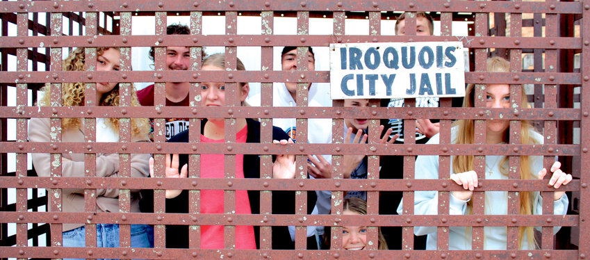 Homecoming candidates are locked in the Iroquois City Jail. Back row: Logan Pekron, King Toby Arbeiter, Braxton Stroud, Logan Peskey and front row is Queen Anna Gross, Kaylee Morehead, Lily Blue, Lexi Burma. See more Homecoming pictures on page 16.