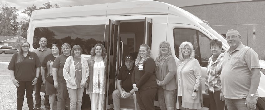 Pictured with the new ROCS Kingsbury County Transit bus that was just delivered Tuesday are ROCS staff and Kingsbury County Transit Board of Directors members.Pictured L to R are Stacy Strickler (Regional Transit Coordinator), Jamie Lancaster, Catherine Campbell, Jodi Jung, Patty Garry, Kristy Hubbard, Peter Smith (ROCS CEO), Traci Smith, Tracey Larson, Rita Anderson, Lynne Lee (Transit driver) and Scott Finck (ROCS Transit Director.)