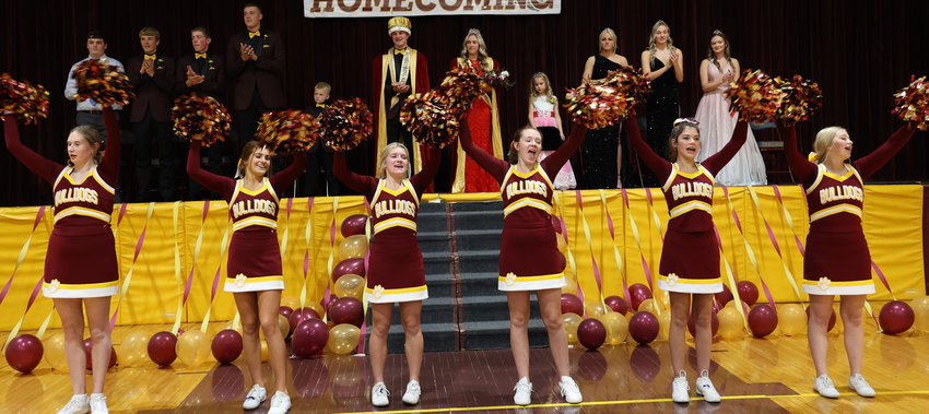 The De Smet Bulldog Cheerleaders lead the crowd in a cheer after Monday night&rsquo;s Coronation where the school crowned Queen Cori Birkel and King Dylan Zell. De Smet Homecoming game is Friday night at 7:00 p.m. against Hitchcock-Tulare.