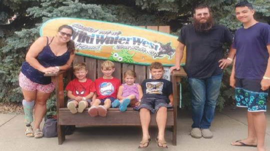 Charlotte, Woody, Willy, Evie, Leo, Brandon and Arthur take time to pose for a family picture at Wild Water West