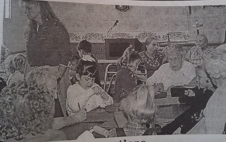 TWENTY-FIVE YEARS AGO: Students from Happy Kids Preschool worked with residents at Kingsbury Memorial Manor in preparing costumes for a Thanksgiving play. The group shared lunch following the work session.