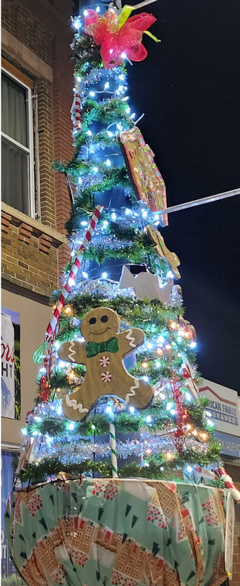 Winners of the Main Street light pole decorating contest are Amanda and Andy Wienk in front of their businesses, Don's Bakery and The Indoor Country Club. They won $50 in Chamber Bucks from Lake Preston Chamber/4 Lakes Forward.