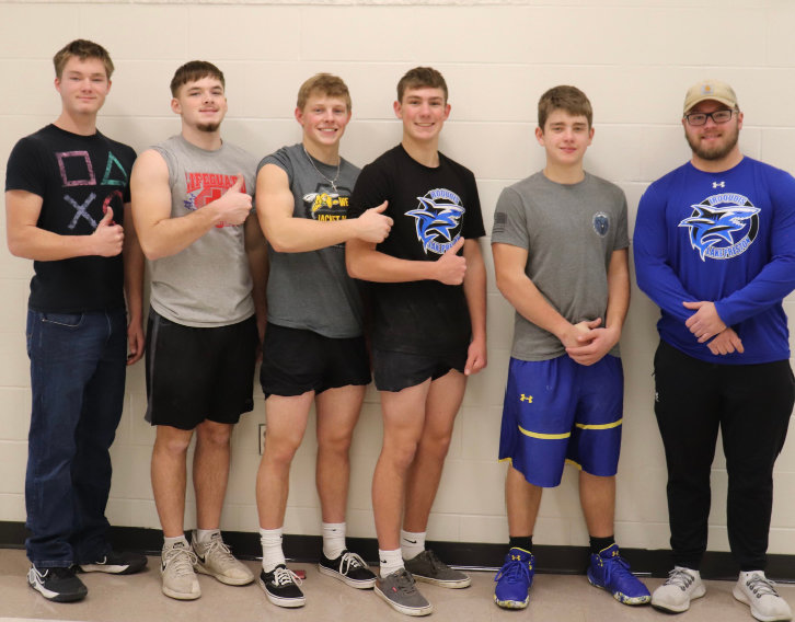 Pictured left to right:  AJ Wienk, (did not lift,) Ashton Wienk, (lifted 840 lbs, 7th place in 198.4 weight class,)  Ben Curd, (lifted 800 lbs, 5th place in 165.3 weight class,) Jake Larsen, (lifted 930 lbs, 2nd place in 165.3 weight class,) Rowdy Scheel, (lifted 550 lbs, 8th place in 165.3 weight class) and Coach Jalen Kaufman.