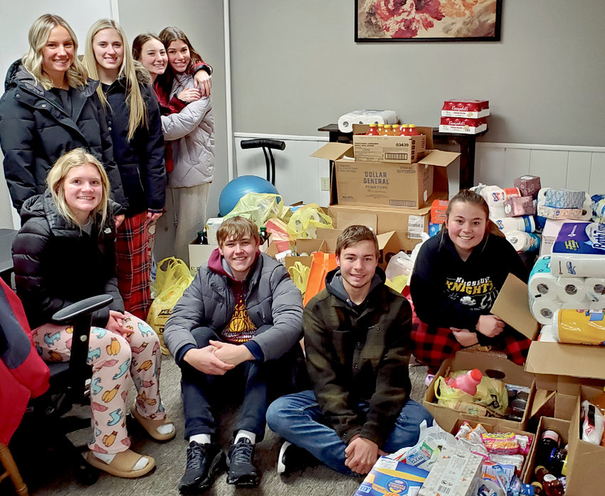 The De Smet High School Student Council collected approximately 1,500 items for the food pantry and delivered them on Wed., Dec. 21, filling the hallway and a room in back. Students include Olivia Johnson, standing left, Cori Birkel, Jacie McCune and Calli Fields; Alyssa Asleson, seated left, Sam Gigov, Tucker Crain and Emily Jennings. Not pictured are student council advisor Mr. Bettin and student council members Brayden Roth, Chauncy Driscoll and Chase Temme.