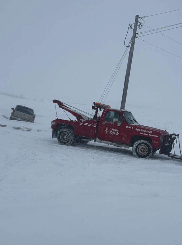 Nate Josephsen with Josie Repair in Lake Preston had a busy day on Tuesday, pulling people out of the ditch. The snow came down quickly, and with the slippery roads and white-out conditions, drivers found it difficult to see.