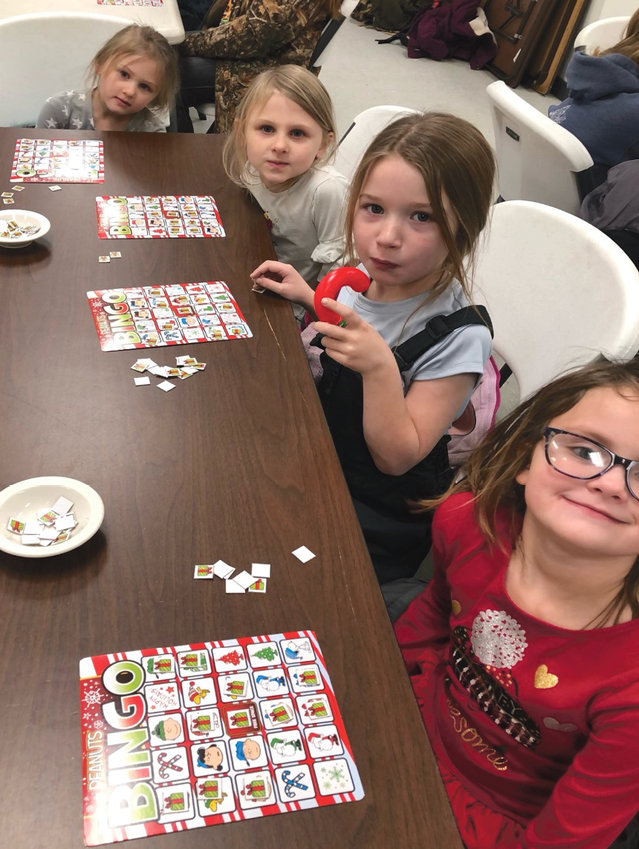 Several Lake Preston youth stopped by the Dorothee Pike Memorial Library on Dec. 21 after the last day of school before the Christmas break. They played rounds of Bingo that featured the characters from the &ldquo;Peanuts&rdquo; cartoon. Pictured left to right: Leah and Grace Pietig, Brooklyn Anderson and Everly Paul.