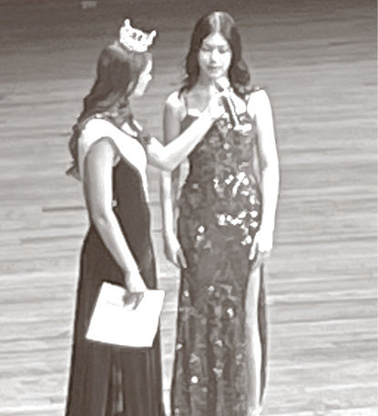 Pageant contestant Calli Fields answers questions on-stage asked by reigning Miss South Dakota Outstanding Teen Olivia Odenbrett.
