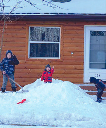 Hayden Rodlund, Jude and Shaun Jacobsen took advantage of the warmer temps on Sunday and got outside to play in the snow.