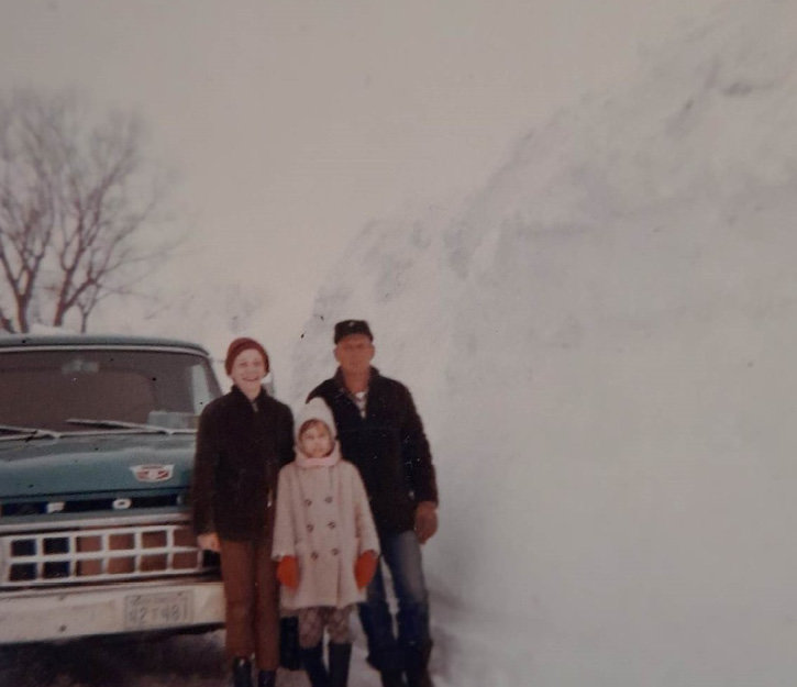 The township road leading to the Wade farm during the winter of 1968-69. Duane Wade, left, Mary Wade Wienbar and Roy Wade.