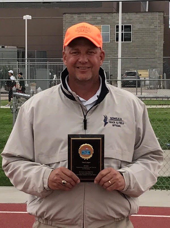 Tim Casper received an award for officiating at the Howard Wood Track Meet.