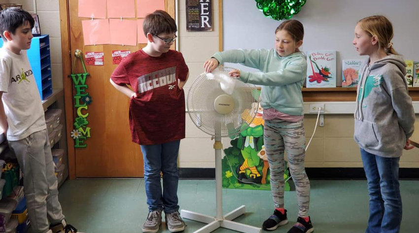 De Smet fourth graders have been studying seed dispersal and ways seeds travel to reproduce. They were challenged to create a device that would carry a corn kernel by wind. They had to choose items to build their devices from a list that were priced to sell. They only had $10.00 to spend on supplies. They learned sometimes less is better!