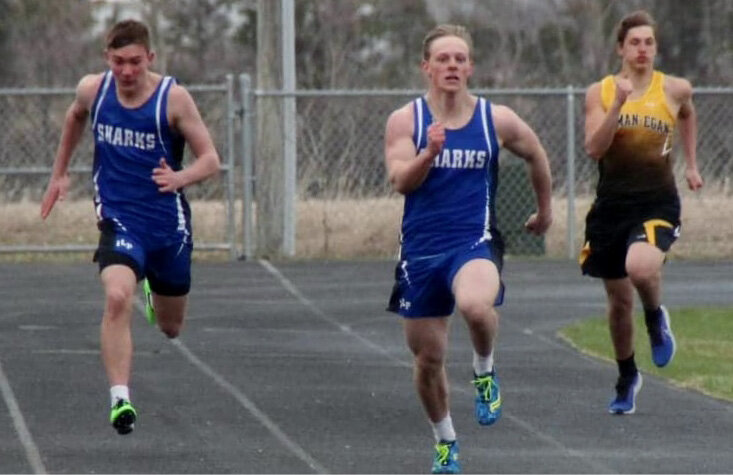 Ben Curd and Jake Larsen competing in the 200-meter dash