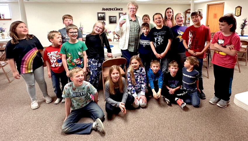 Susan Olson, one of the leaders of Kids for Christ, enjoying time with the children during the last meeting until next October.