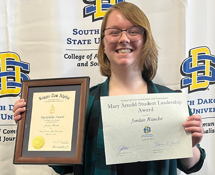 Jordan Rusche, daughter of Warren and April Rusche, Bancroft, receiving a few of her many academic and journalism awards before graduating from South Dakota State University on May 6, 2023.