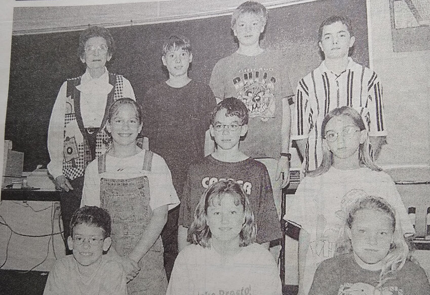TWENTY-FIVE YEARS AGO: The winners of the American Legion Auxiliary poppy poster contest shown with auxiliary member Joann Helland are top left - sixth graders Dustin Jones, Danny McLaughlin and Adam Odden; middle left - Kristin Hesby, Sterling Eschenbaum and Megan Cass; bottom left - Ty Eschenbaum, Kayla Cleveland and Bridget Malone.