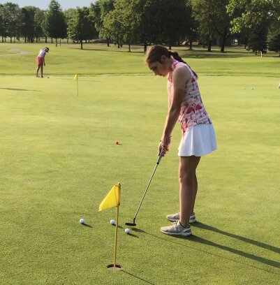 De Smet's Harper Anderson fine tunes her putting before hitting the links at Cattail Crossing golf course during the state tournament in Watertown this week.