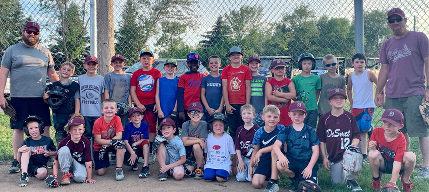 Coach Aaron Grubb (right) and Assistant Coach Casey Harty (left) enjoyed a fun game of baseball with the 6U and 8U De Smet baseball teams on Thurs., June 29.
