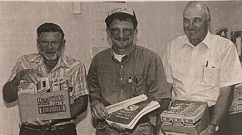 TWENTY-FIVE YEARS AGO: Members of the Knights of Columbus at St. Thomas Catholic Church are offering free school supplies to Kingsbury County youngsters who need them. Knights shown with the free supplies are Val Gross, left, Steve Maras and Vincent Spader.