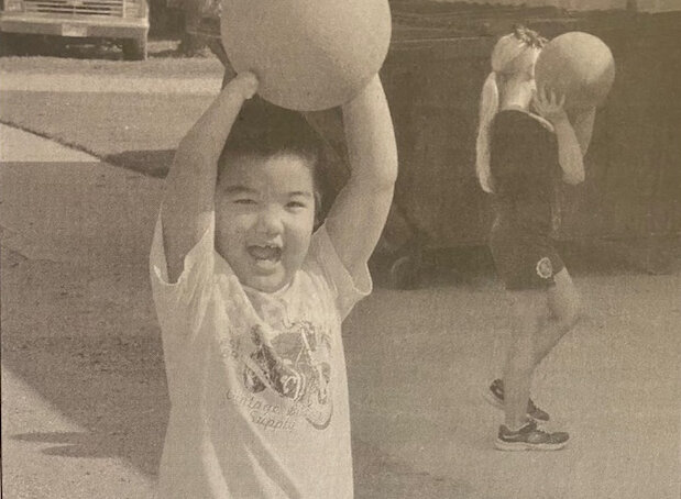 TEN YEARS AGO:  Second-grader Willem Lim prepares to throw a ball Monday during recess. It was the first day of school for De Smet students.