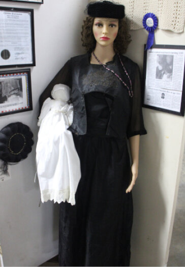 Anna Peskey&rsquo;s nursing dress was sewn by a family member and designed with a special fold down panel to nurse a baby. It is among the items on display at the Carthage Straw Bale Built Museum.