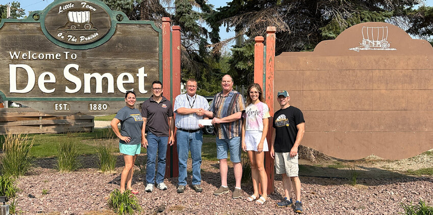 Amanda Fields, Eric Fairchild, Chris Duklet, Chad Kruse, Billi Aughenbaugh and Dave Fields from the Chamber meet with Duklet to accept the $1,000 donation check from UltiMed, Inc.
