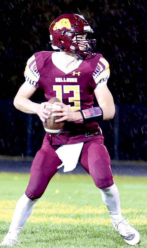 De Smet&rsquo;s Britt Carlson looks for a receiver through chilly wind and rain in Friday night&rsquo;s 2-12 loss to Class 9AA Elkton-Lake Benton.