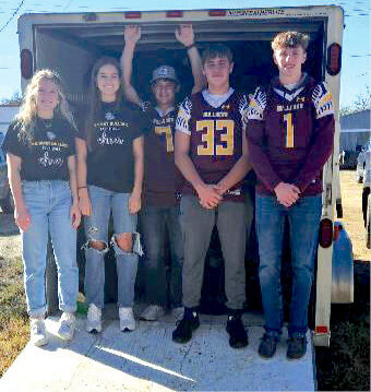 When the Iroquois drop-off location had 60 bags of clothing to deliver to the De Smet Food Pantry on Thurs., Oct. 19, five De Smet High School juniors including Alyssa Asleson, left, Mirra Beck, Gannon Gilligan, Sam Gigov and Ganon Henrich volunteered to help load the bags of clothing into the trailer for the Kingsbury County Clothing Drive.