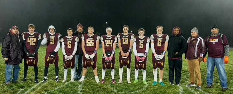 De Smet seniors won their last game on Wilkinson field as they advanced through the playoffs. The Bulldogs travel to take on Avon in the semifinal game this Friday, with a trip to the dome on the line. Pictured are coach Mark Birkel (left), Tristan Olson, Edger Wilkinson, Wyatt Rigge, coach Dave Van Regenmorter, River Hornig, Kadyn Fast, Britt Carlson, Tom Aughenbaugh, Trace Van Regenmorter, coaches Clifford Geyer, Brendon Pitts and Dan Wilkinson.