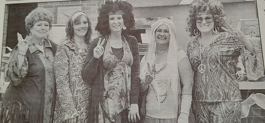 TEN YEARS AGO: First National Bank employees Loretta Malone, Lisa Baruth, Missy Olson, Marlys Vincent and Amber Steffensen embraced Halloween by dressing up as colorful hippies.