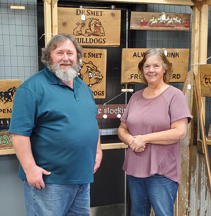 Les and Michelle Howard stand among some of their reclaimed barnwood creations at the De Smet Craft &amp; Gift Fair on Sat., Nov. 18 at the De Smet Event Center.