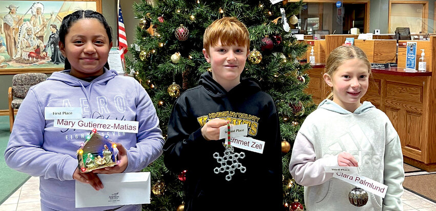 Each year, De Smet&rsquo;s American Bank &amp; Trust invites all fifth grade students at Laura Ingalls Wilder Elementary School to make an ornament. This year's winners are Mary Gutierrez-Matias, first place; Emmet Zell, second place and Clara Palmlund, third place.