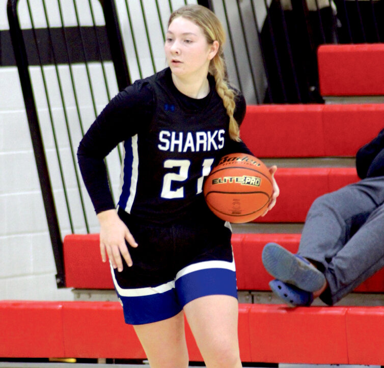 Sharks junior forward Kera Dubro looks for an opening against Highmore-Harrold Friday night. Dubro made the game-winning shot with 7.9 seconds remaining, delivering a 48-47 Sharks win.