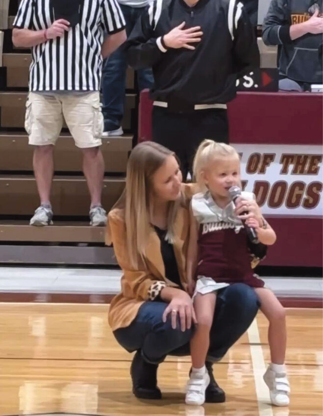Three-year-old rockstar Sylvie Johnson, daughter of Taylor and Tracy Johnson, sang the Star Spangled Banner at the De Smet vs Arlington game on Friday night.